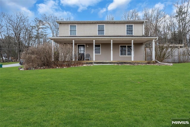 front facade featuring a front lawn and covered porch