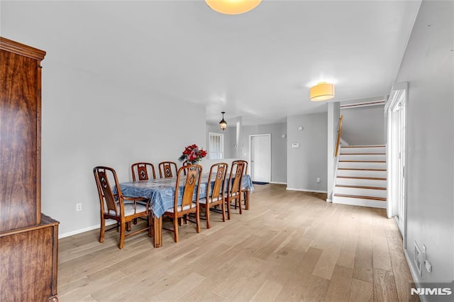 dining room with light hardwood / wood-style floors