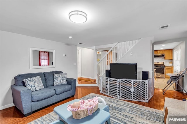 living room with light hardwood / wood-style floors