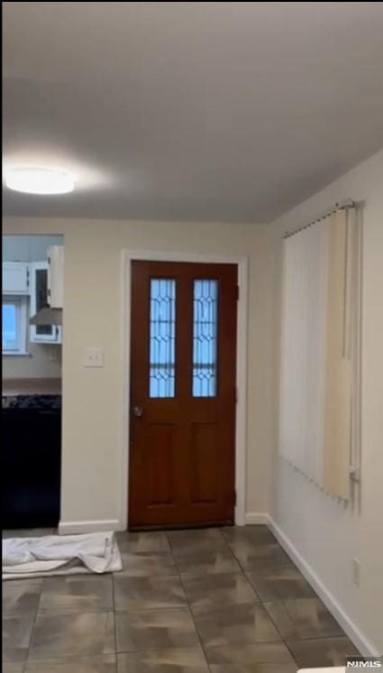 entrance foyer featuring tile patterned floors