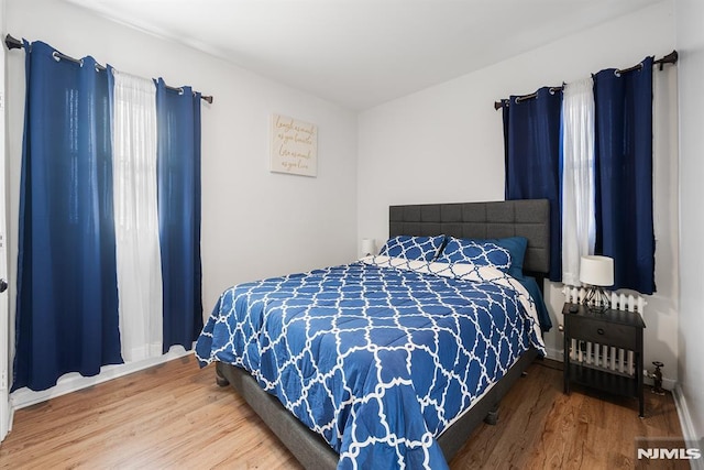 bedroom featuring hardwood / wood-style flooring