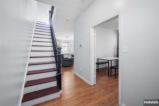 stairway featuring hardwood / wood-style floors