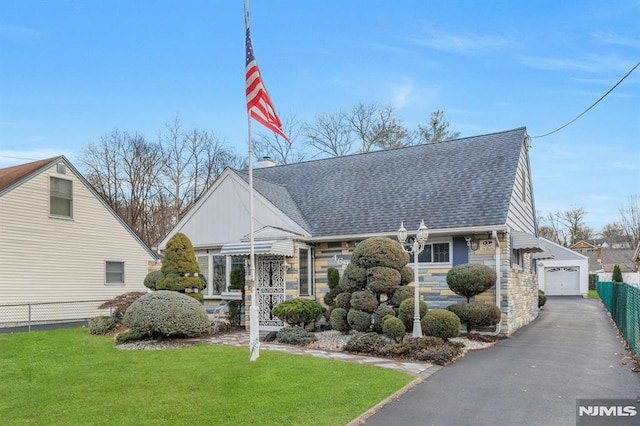 view of front of house with a front lawn and a garage