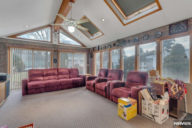 carpeted living room featuring ceiling fan and vaulted ceiling with beams