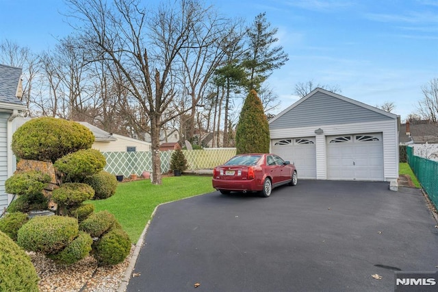 garage with a yard