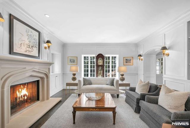 living room featuring crown molding