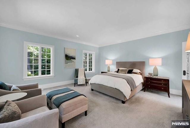 carpeted bedroom featuring ornamental molding