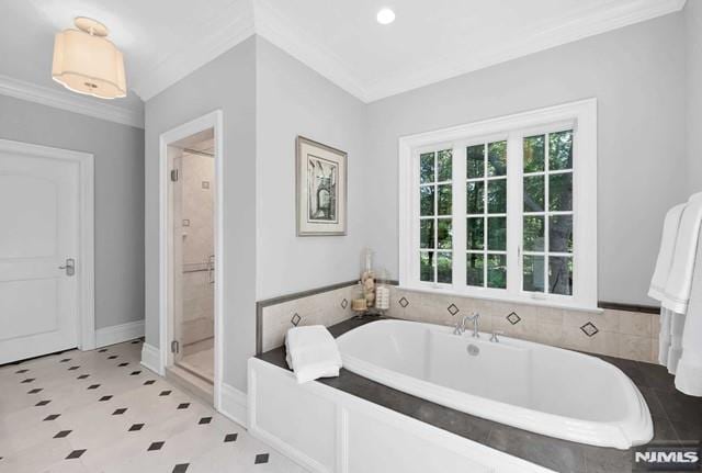 bathroom featuring crown molding and plus walk in shower