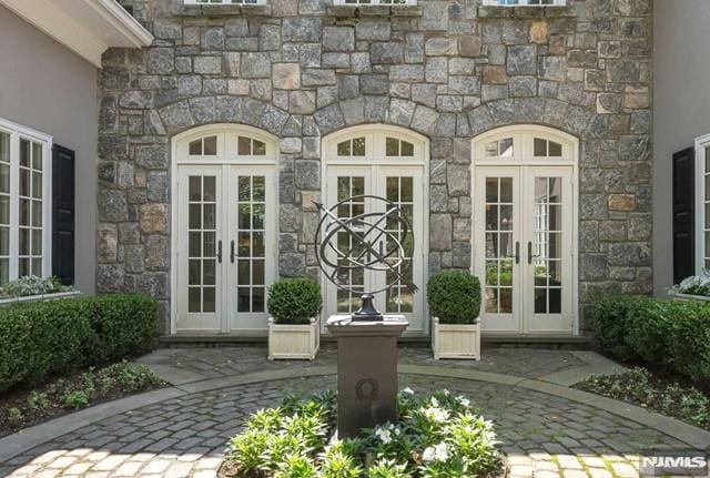 property entrance featuring french doors