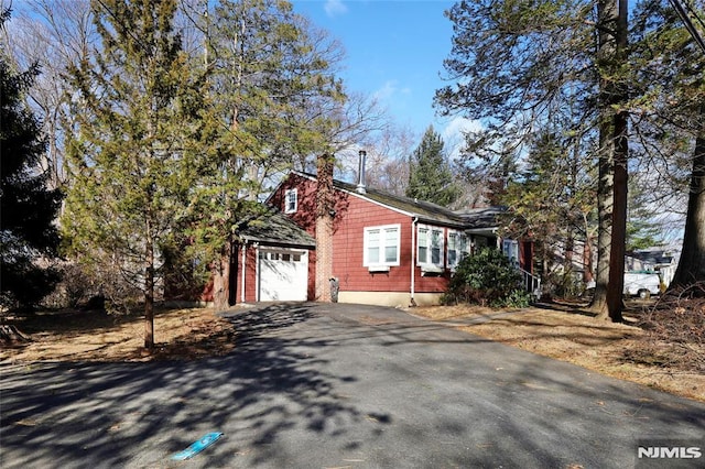 view of side of home with a garage