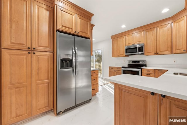 kitchen featuring stainless steel appliances and sink