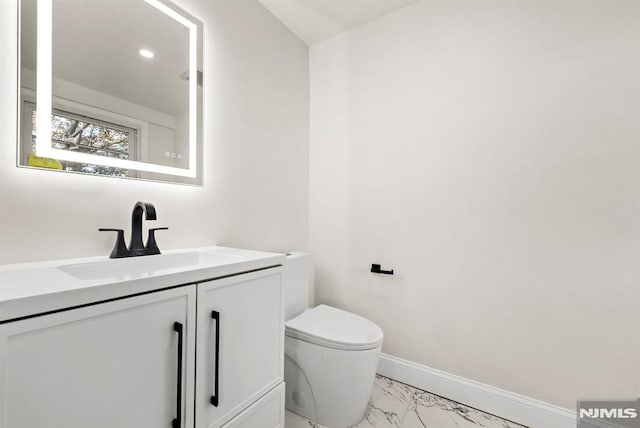 bathroom with vanity and toilet