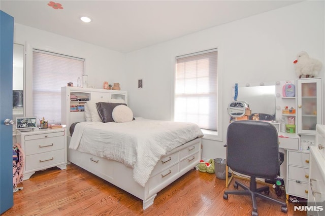 bedroom with light wood-type flooring