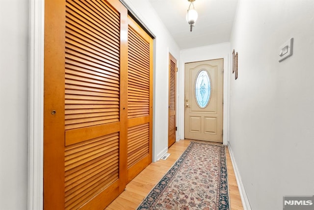 doorway featuring light hardwood / wood-style floors