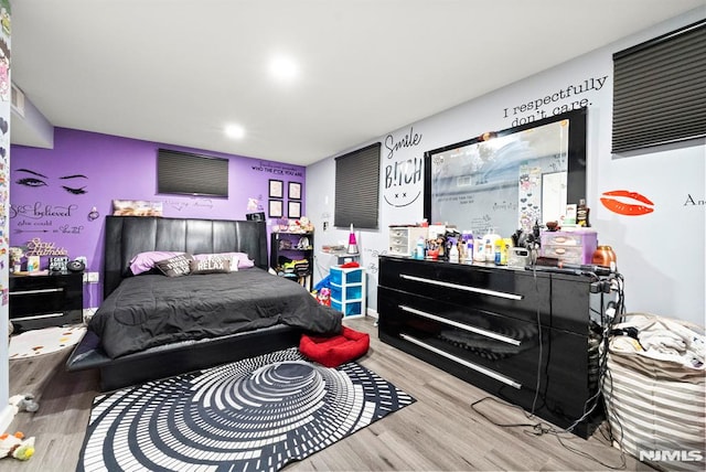 bedroom with light wood-type flooring