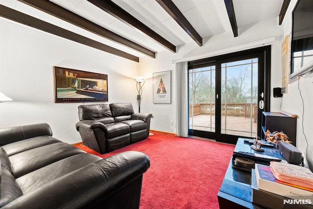 living room with beamed ceiling and carpet flooring