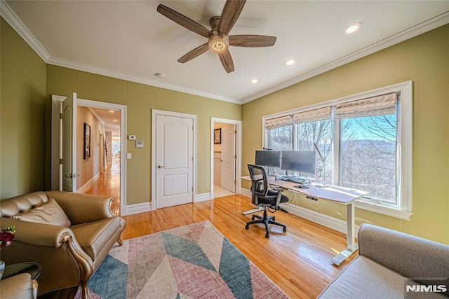 office area featuring ceiling fan, wood-type flooring, and crown molding