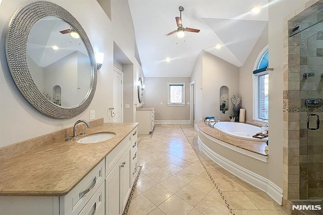 bathroom with vanity, tile patterned floors, vaulted ceiling, ceiling fan, and independent shower and bath