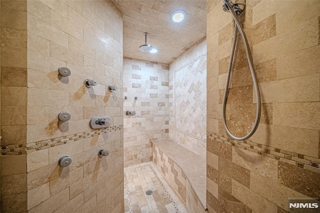 bathroom featuring a tile shower