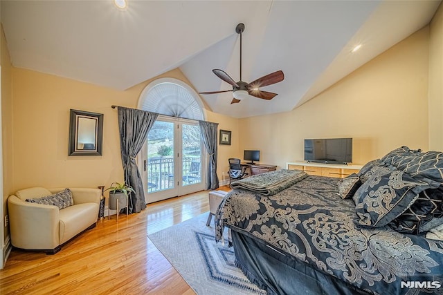 bedroom with ceiling fan, access to exterior, light wood-type flooring, and vaulted ceiling