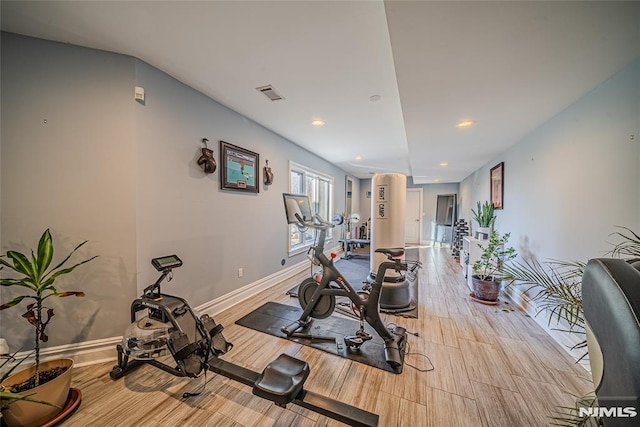 exercise area featuring light hardwood / wood-style flooring