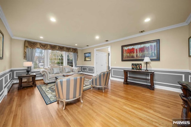 living room featuring crown molding and wood-type flooring