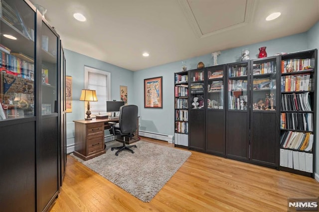 office area featuring light hardwood / wood-style flooring and a baseboard radiator