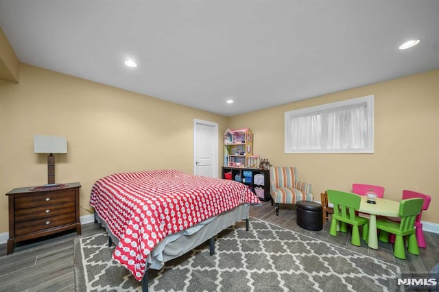 bedroom with dark wood-type flooring