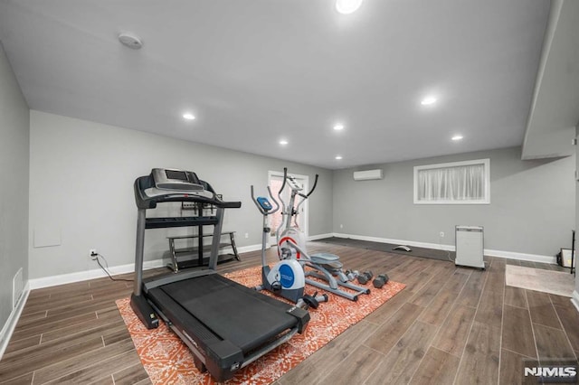 exercise room with a wall unit AC