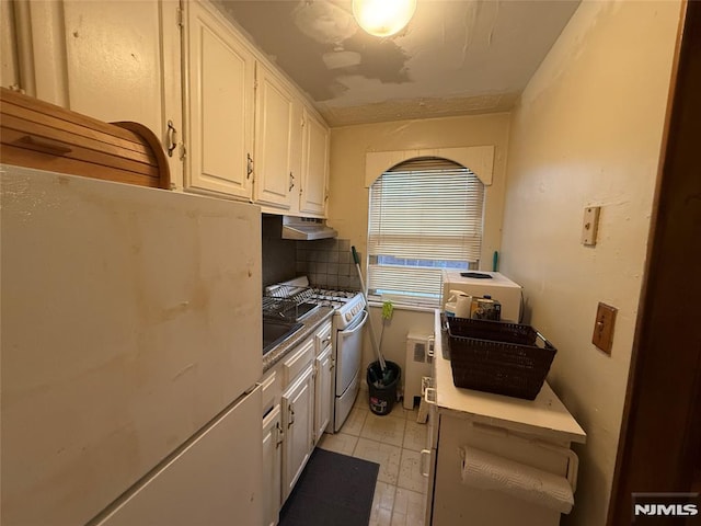 kitchen featuring white cabinetry, white appliances, radiator heating unit, and tasteful backsplash