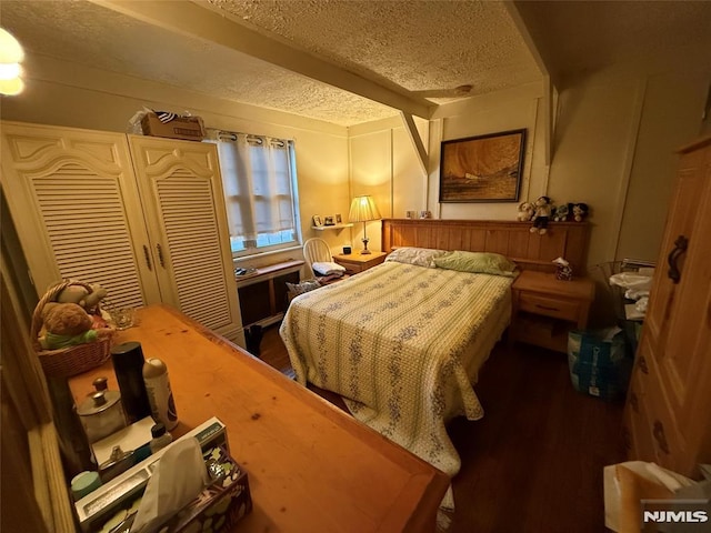 bedroom featuring a textured ceiling