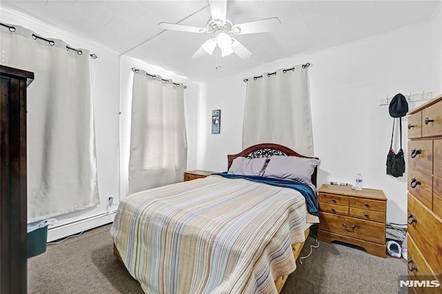 carpeted bedroom with ceiling fan and a baseboard heating unit