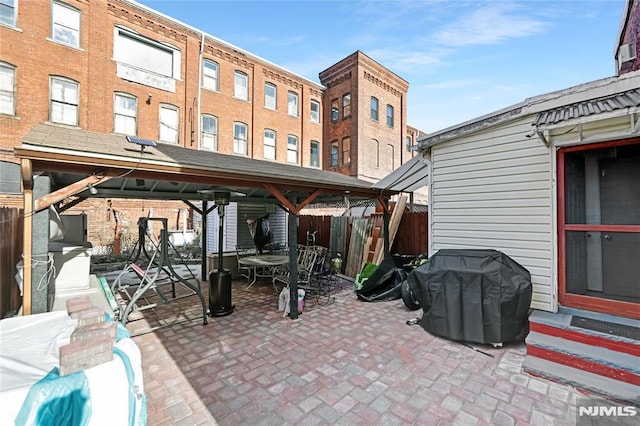 view of patio featuring a gazebo and a grill