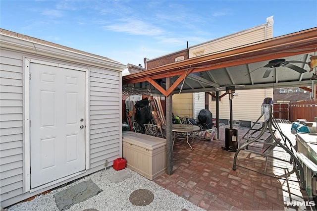 view of patio / terrace featuring a gazebo and ceiling fan