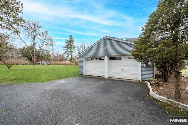 garage with a lawn