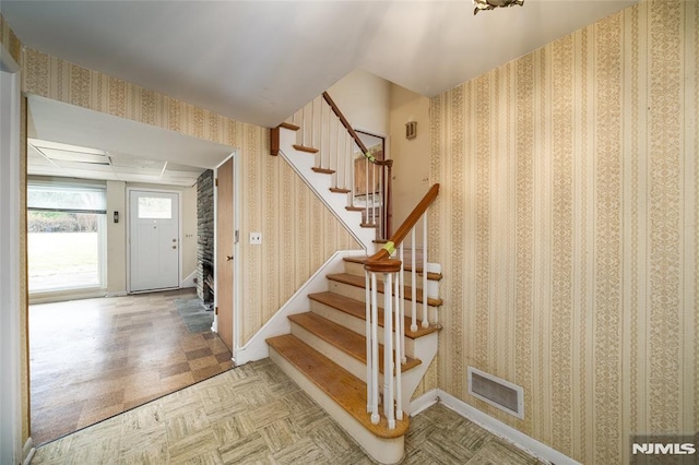 foyer featuring parquet flooring