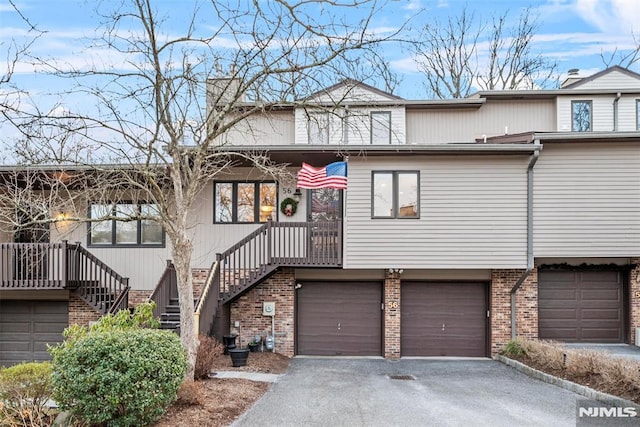 townhome / multi-family property featuring a garage