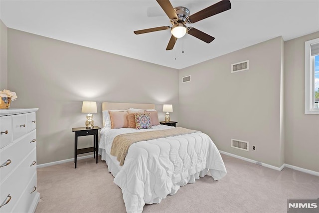 bedroom featuring ceiling fan and light colored carpet