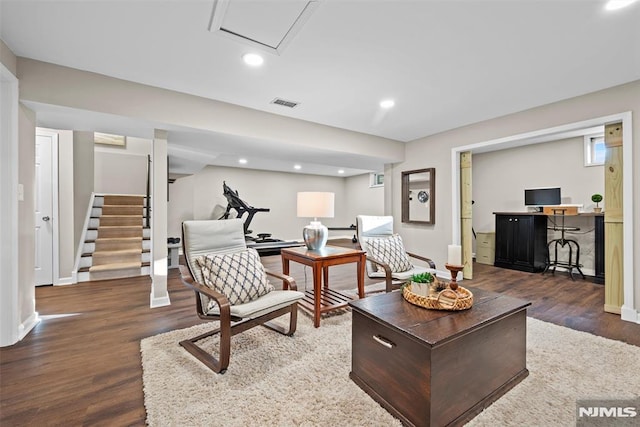 living room with dark hardwood / wood-style flooring