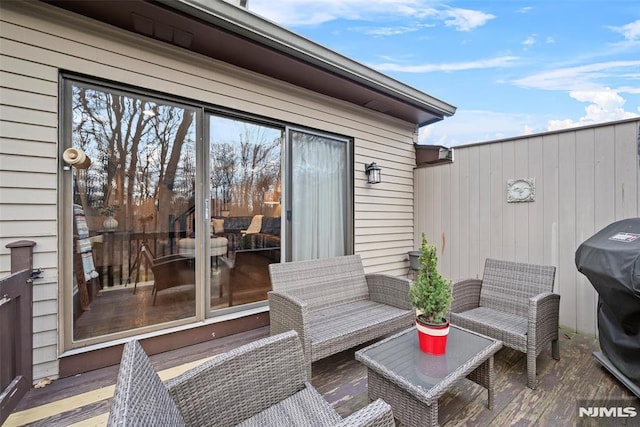 wooden deck with outdoor lounge area