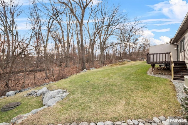 view of yard with a wooden deck