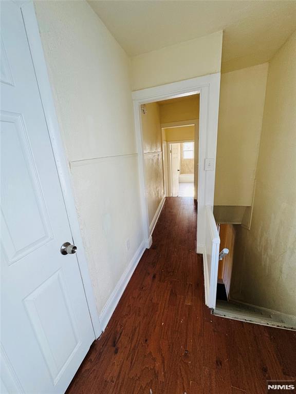 hall featuring dark hardwood / wood-style floors