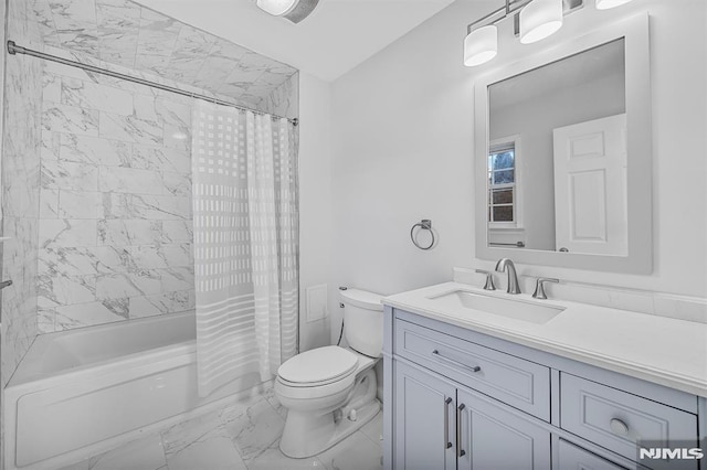 full bathroom with vanity, shower / tub combo, and toilet