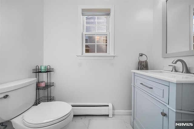 bathroom with vanity, a baseboard radiator, and toilet