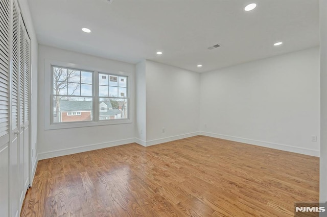 empty room with light hardwood / wood-style floors