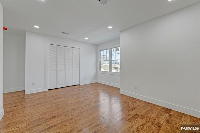 unfurnished bedroom featuring light wood-type flooring