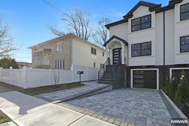 view of front of property featuring a garage