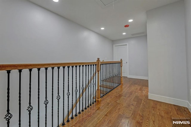 hall with light hardwood / wood-style flooring