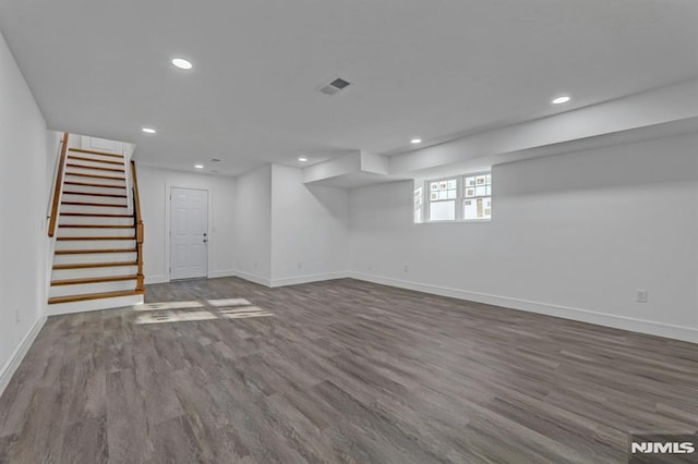 basement featuring wood-type flooring