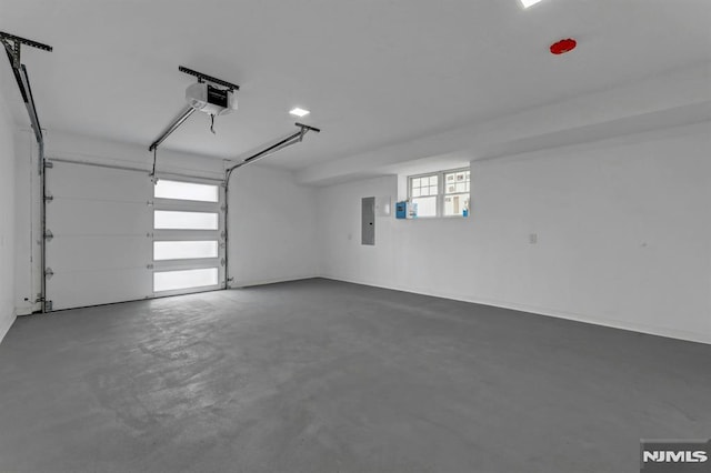 garage featuring a garage door opener and electric panel